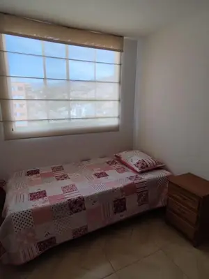a bedroom with a bed and a window at Hermosa habitación con múltiples áreas comunes in Bello