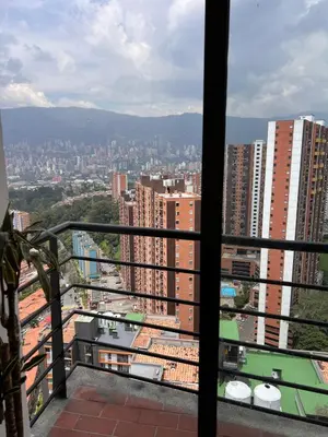 a view of a city from a balcony at Beautiful 29th floor apartment with a view in Medellín