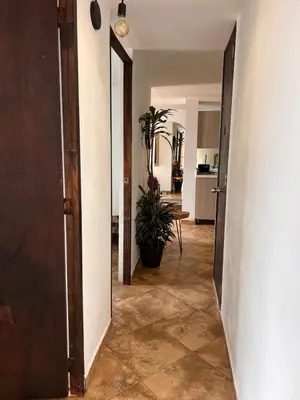 an open hallway with a plant in a room at Beautiful 29th floor apartment with a view in Medellín