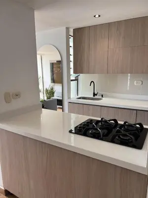 a kitchen with a stove and a counter top at Beautiful 29th floor apartment with a view in Medellín