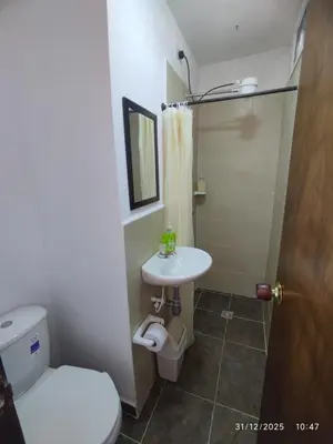 a bathroom with a toilet and a sink at YoAmoJardín, Parejas, es como estar en casa in Jardin