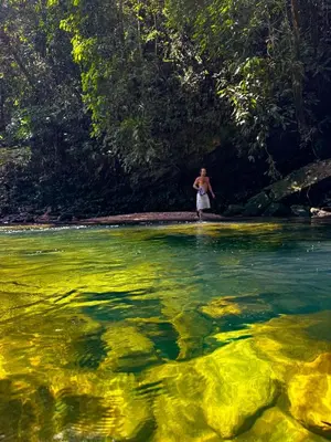 a person standing in a body of water at Selvática Ecohotel y Centro Holístico in San Carlos