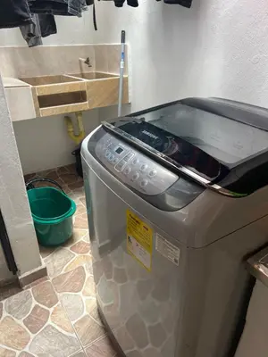 a kitchen with a toaster sitting on the floor at Home river in Itagüí
