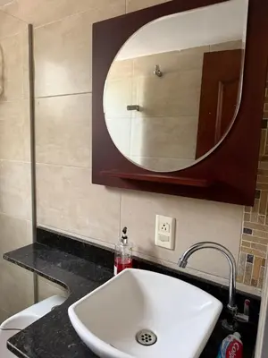 a bathroom with a sink and a mirror on the wall at Pilar house in Medellín
