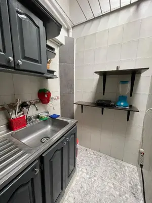 a small kitchen with a sink and a counter at Tu rincón en Medellín in Medellín