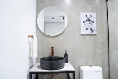 a bathroom with a sink and a mirror at Provenza luxury parque Lleras D'house, happy house in Medellín