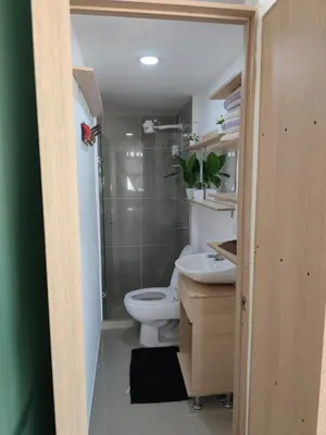 a bathroom with a toilet and a shower and a sink at apartaestudio in Medellín