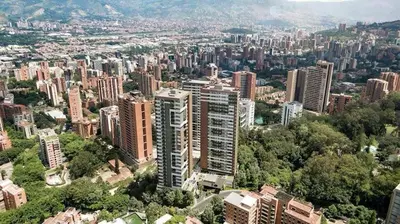 an aerial view of a city with tall buildings at El Poblado Prime Location Medellin Apt in Medellín