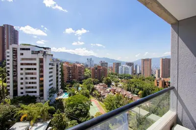 a view of a city from a balcony at El Poblado Prime Location Medellin Apt in Medellín