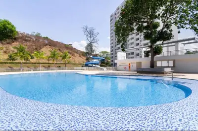 an empty swimming pool in the middle of a building at Apartasol Moderno bajo el Sol de Santa Fe in Santa Fe de Antioquia