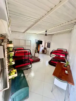 a room with a bunch of bunk beds in it at Cabaña en Santorini in Puerto Triunfo