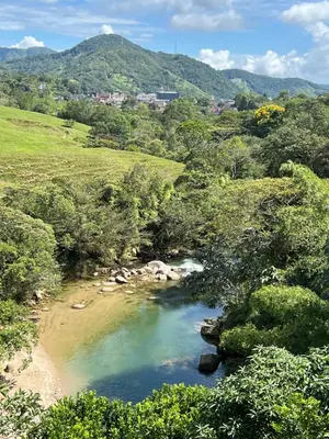 a river in the middle of a valley with trees at Playa Primavera in San Carlos