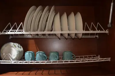 a shelf with a bunch of cups and plates at Apto Amoblado 3 Hab Cerca al Atanasio in Medellín