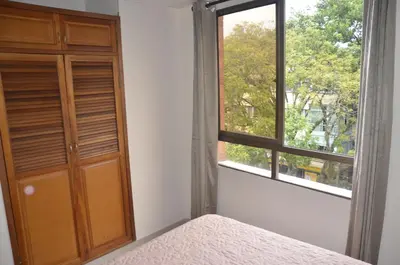 a bedroom with a window and a bed and a door at Apto Amoblado 3 Hab Cerca al Atanasio in Medellín