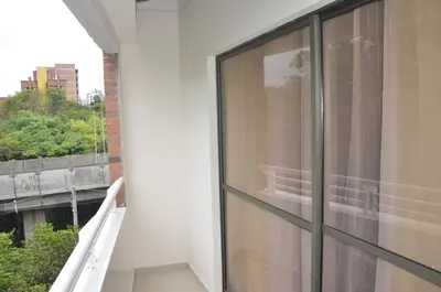 a balcony of a building with a window at Apto Amoblado 3 Hab Cerca al Atanasio in Medellín