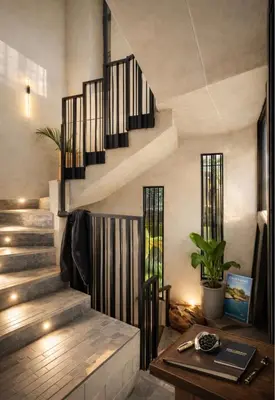 a spiral staircase in a house with a table at CEMNTUS VILLA , Rooftop Jacuzzi, 9BR, VIP Service in Medellín