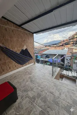a room with a hammock on the wall at House with Terrace San Javier Comuna 13 in Medellín