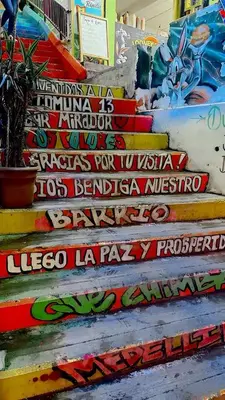 a group of stairs with graffiti on them at House with Terrace San Javier Comuna 13 in Medellín