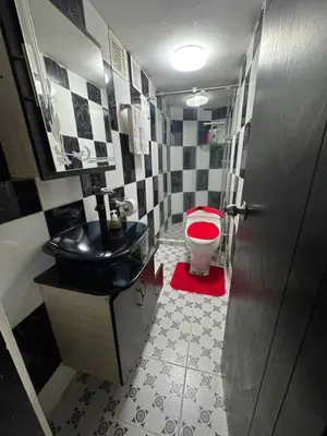 a bathroom with a black sink and a toilet at House with Terrace San Javier Comuna 13 in Medellín
