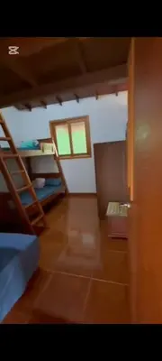 a room with a bunk bed and a ladder at Casa de piedra #35 in San Rafael