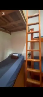 a bunk bed and a ladder in a room at Casa de piedra #35 in San Rafael