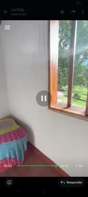 a video of a room with a bed and two windows at Casa de piedra #35 in San Rafael