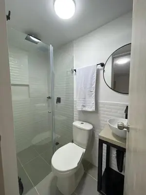 a bathroom with a toilet and a sink and a shower at Living Yellow in Alpujarra