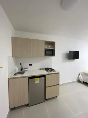 a kitchen with a sink and a stove top oven at Living Yellow in Alpujarra