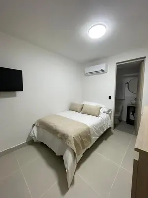 a bedroom with a bed in a white room at Living Yellow in Alpujarra