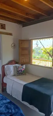 a bedroom with two beds and a window at Casa Madreselva in Jardin