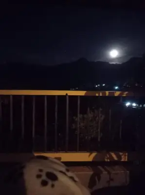 a view of the moon from a balcony at night at Casa Madreselva in Jardin