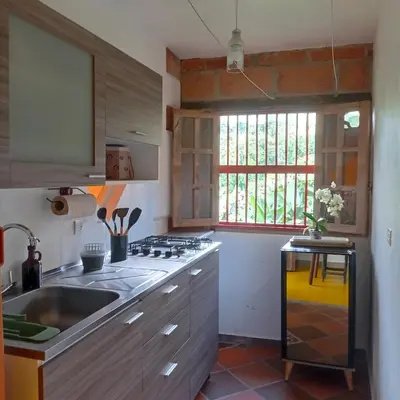 a kitchen with a sink and a stove at Casa Madreselva in Jardin