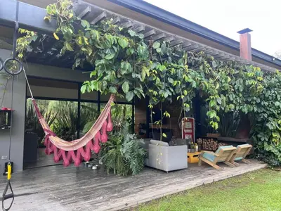 a building with a bunch of plants on it at Beautiful house in nature minutes from Medellín in El Retiro