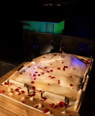 a cake with white frosting and red sprinkles at Hotel Elixer Habitat in Santa Rosa de Cabal