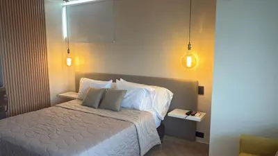a bedroom with a bed with two pillows at Studio apartment in El Poblado next to Oviedo Mall in Medellín