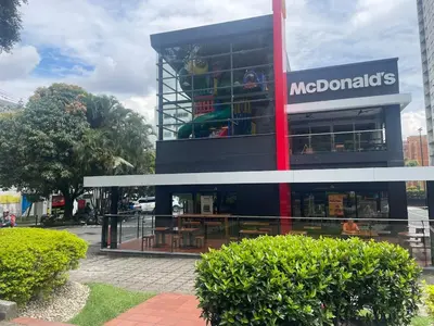 a large building with a nederlanders sign on it at Studio apartment in El Poblado next to Oviedo Mall in Medellín