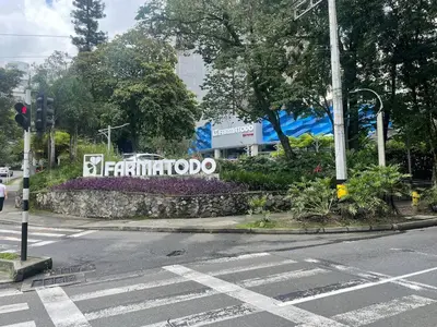 an intersection with a street with a traffic light and a sign at Studio apartment in El Poblado next to Oviedo Mall in Medellín