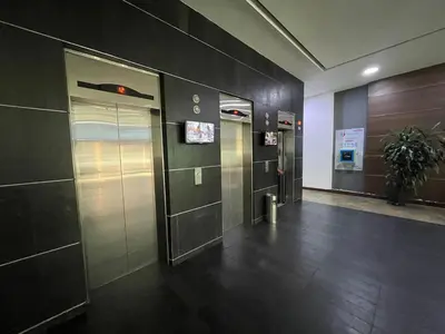 a hallway with two elevators in a building at Studio apartment in El Poblado next to Oviedo Mall in Medellín