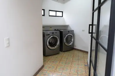 a laundry room with a washer and dryer at Duplex First laureles park in Medellín