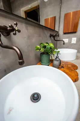 a bathroom with a white sink and a mirror at Duplex First laureles park in Medellín