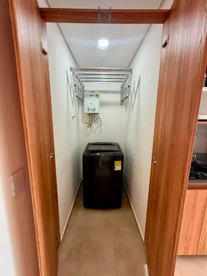 a hallway with a trash can in a room at Lujoso y cómodo Loft en Laureles in Medellín