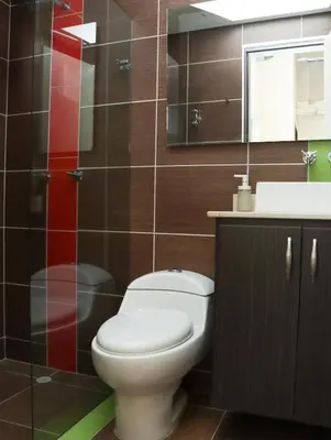 a bathroom with a toilet and a sink at Relax Medellín 10ppl 3br 4b Jacuzzi 2,075 sq ft in Medellín