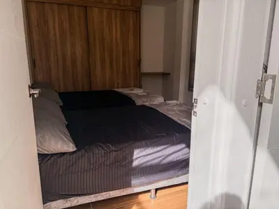 a bed in a room with a door open at masion la catedral de pablo con vista a la montaña in Envigado