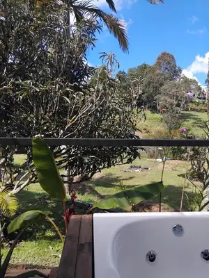 a bathroom sink with a view of a park at El Palmar Lodge in Chiquinquirá