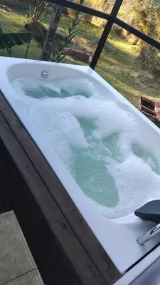 a jacuzzi tub covered in ice and water at El Palmar Lodge in Chiquinquirá