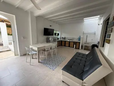 a living room with a couch and a table at Cabañas Milos in Doradal