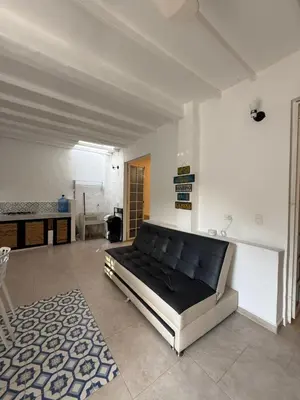 a large bedroom with a large bed in a room at Cabañas Milos in Doradal