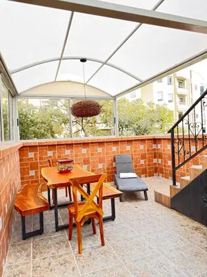 a patio with a white canopy and a table and chairs at SkyView Medellín 4ppl 1br 1b luxury terrace loft in Medellín
