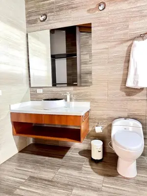 a bathroom with a sink and a toilet and a mirror at SkyView Medellín 4ppl 1br 1b luxury terrace loft in Medellín