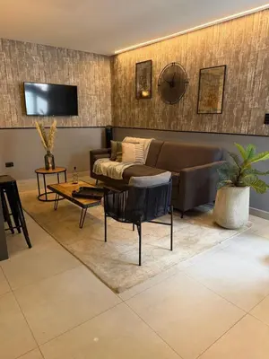 a living room with a couch and a table at Poblado Walkable Loft - Parking Included in Medellín